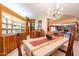 Spacious dining room with a chandelier, adjacent to a billiards room and kitchen at 801 W Tyson St, Chandler, AZ 85225