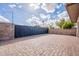 Paver driveway, large steel automatic gate, and privacy walls provide a secure and beautiful entrance at 801 W Tyson St, Chandler, AZ 85225
