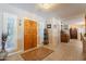 Bright foyer with a decorative wooden door, shuttered windows, and tile flooring at 801 W Tyson St, Chandler, AZ 85225