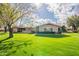 Attractive single-story home with well-maintained landscaping and an American flag displayed in the front yard at 801 W Tyson St, Chandler, AZ 85225