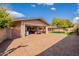 Organized garage features a red convertible, storage, and access to a lush backyard at 801 W Tyson St, Chandler, AZ 85225