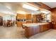 Open kitchen boasts wood cabinets, a center island with seating, and an adjacent dining area at 801 W Tyson St, Chandler, AZ 85225