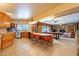 Open-concept kitchen flows into a living area with a pool table, creating an ideal space for entertaining at 801 W Tyson St, Chandler, AZ 85225