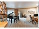Office with piano, built-in shelving, wood cabinets, and a view to bedroom at 801 W Tyson St, Chandler, AZ 85225