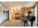 Home office featuring grand piano, custom built-in wood cabinets, and a desk at 801 W Tyson St, Chandler, AZ 85225