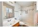Remodeled bathroom with tiled shower, glass door, modern fixtures and a sink at 828 W Laguna Dr, Tempe, AZ 85282