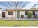 Charming single-story home with a well-maintained lawn, desert landscaping, and a freshly painted exterior at 828 W Laguna Dr, Tempe, AZ 85282