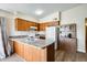 Updated kitchen featuring wooden cabinetry, modern appliances, and ample counter space at 828 W Laguna Dr, Tempe, AZ 85282