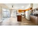 Well-lit kitchen area with modern floors, ample cabinet space, and a convenient island at 828 W Laguna Dr, Tempe, AZ 85282