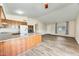 Open-concept living room features a large kitchen island, wood flooring, and plenty of natural light at 828 W Laguna Dr, Tempe, AZ 85282