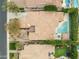 Bird's eye view of the home's layout, lush backyard with pool, and well-manicured landscaping at 9869 E Davenport Dr, Scottsdale, AZ 85260