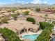 Overhead view showing the home, pool, patio, and the scenic mountain backdrop at 9869 E Davenport Dr, Scottsdale, AZ 85260