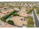 High aerial view of the property highlighting the pool, landscaping, and neighborhood at 9869 E Davenport Dr, Scottsdale, AZ 85260