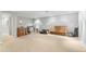 Spacious room with neutral walls and carpet, featuring a lamp and decorative rug on the floor at 9869 E Davenport Dr, Scottsdale, AZ 85260