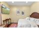 Bedroom with a TV, patterned rug, and a wooden headboard at 9869 E Davenport Dr, Scottsdale, AZ 85260