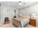 Bedroom with a decorative bed, side table, night stand, and ensuite bathroom at 9869 E Davenport Dr, Scottsdale, AZ 85260
