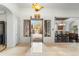 Inviting foyer with tile flooring, open doorway, and views of the landscaped front yard at 9869 E Davenport Dr, Scottsdale, AZ 85260