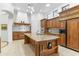 Spacious kitchen with granite countertops, stainless steel appliances and custom cabinets at 9869 E Davenport Dr, Scottsdale, AZ 85260