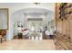 Elegant living room with high ceilings, hardwood floors, and a view of the outdoor pool at 9869 E Davenport Dr, Scottsdale, AZ 85260