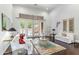 Bright living room with high ceilings, french doors to pool, and elegant decor at 9869 E Davenport Dr, Scottsdale, AZ 85260