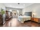 Spacious primary bedroom with hardwood floors, sitting area, and natural light at 9869 E Davenport Dr, Scottsdale, AZ 85260