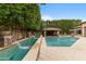 Stunning pool area featuring a water feature and outdoor lounge area, perfect for relaxation and entertainment at 9869 E Davenport Dr, Scottsdale, AZ 85260