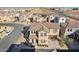 Aerial view of the home showcasing the tile roof, landscaping, and neighborhood at 9923 E Texas Ave, Mesa, AZ 85212