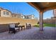 Inviting backyard patio with comfortable seating and low maintenance turf at 9923 E Texas Ave, Mesa, AZ 85212