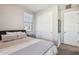 Neutral bedroom with a window and closet at 9923 E Texas Ave, Mesa, AZ 85212