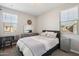 Serene bedroom with calming colors, ample natural light, and stylish contemporary furnishings at 9923 E Texas Ave, Mesa, AZ 85212