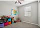 Cozy ' bedroom with neutral walls, window for natural light, and playful toy storage at 9923 E Texas Ave, Mesa, AZ 85212