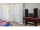 Bedroom with table covered in colorful cloth next to closet door at 9923 E Texas Ave, Mesa, AZ 85212
