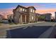 Charming two-story home featuring an arched front porch and desert landscaping at 9923 E Texas Ave, Mesa, AZ 85212