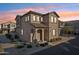 Charming two-story home featuring a neutral stucco exterior and desert landscaping at 9923 E Texas Ave, Mesa, AZ 85212