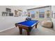 Bright game room with a pool table, bean bag chair, and wall decorations at 9923 E Texas Ave, Mesa, AZ 85212