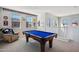 Spacious game room with a pool table, comfortable seating, and view of the neighborhood at 9923 E Texas Ave, Mesa, AZ 85212