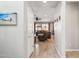 Inviting hallway leading into open-concept living area with comfortable seating and bright natural light at 9923 E Texas Ave, Mesa, AZ 85212