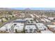 Scenic aerial view displays the complex in relation to the surrounding cityscape and distant mountain views at 1111 E Missouri Ave # 9, Phoenix, AZ 85014