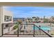 Unit balcony view overlooking the community pool on a bright sunny day at 1111 E Missouri Ave # 9, Phoenix, AZ 85014