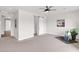 Spacious bedroom features plush carpeting, a ceiling fan, and a decorative painting at 1111 E Missouri Ave # 9, Phoenix, AZ 85014