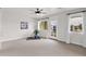 Bright bedroom features plush carpeting, ceiling fan, and a view to the outside balcony at 1111 E Missouri Ave # 9, Phoenix, AZ 85014