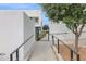 Exterior walkway with landscaping, a gate, and a ramp for accessibility at 1111 E Missouri Ave # 9, Phoenix, AZ 85014