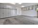 Spacious garage with storage cabinets and room for parking at 1111 E Missouri Ave # 9, Phoenix, AZ 85014