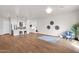 Open-concept living room showcasing hardwood floors, modern decor, and seamless flow to the kitchen, perfect for entertaining at 1111 E Missouri Ave # 9, Phoenix, AZ 85014