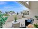 View from covered patio to the community pool, featuring stylish outdoor seating and decorative plants at 1111 E Missouri Ave # 9, Phoenix, AZ 85014