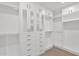 Walk-in closet features custom built-ins, shelving, and ample storage space at 1111 E Missouri Ave # 9, Phoenix, AZ 85014