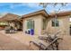 A view of an outdoor living space with shade, brick pavers, and lounge chairs at 11123 E Olla Ave, Mesa, AZ 85212