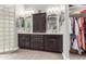 Elegant bathroom with dual sinks, dark wood cabinetry, and a glass block shower wall at 11123 E Olla Ave, Mesa, AZ 85212
