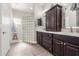 Bright bathroom featuring a dual sink vanity with a glass block shower in the background at 11123 E Olla Ave, Mesa, AZ 85212