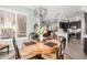 Dining area featuring a round table with seating, alongside kitchen with stainless steel appliances at 11123 E Olla Ave, Mesa, AZ 85212